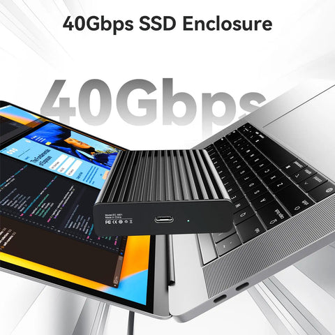 Blazing Fast 40Gbps NVMe M2 SSD Enclosure Handles Up To 8TB beside a laptop, showcasing aluminum casing and USB-C connection.