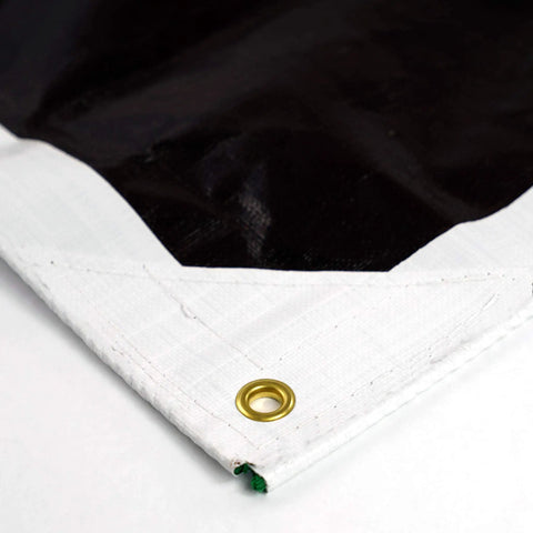 Corner view of HydraTarp Pro Heavy Duty 16 Mil Thick Waterproof Tarp Reversible White And Brown 16 X 20 Feet with brass grommet