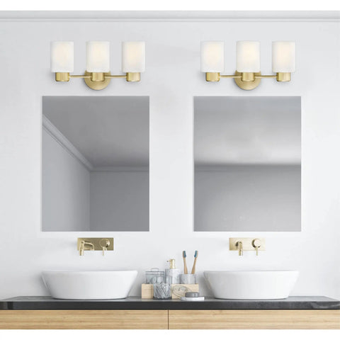 Three Light Wall Fixture In Champagne Brass Finish With Frosted Glass For Vanity Or Bath Mounts Up Or Down over dual sinks