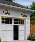 Exterior view of a garage with Gooseneck Barn Light With 15 Inch Arm Dusk To Dawn Outdoor Porch Fixture Vintage Rustic Exterior Lighting.