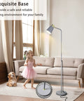Dope Industrial Floor Lamp With Adjustable Metal Heads in living room, grey finish, child and dog in cozy setting