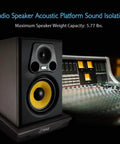 Studio speaker on isolation platform with control board, featuring Speaker Isolation Pads For Studio Monitors Subwoofers And Loudspeakers.