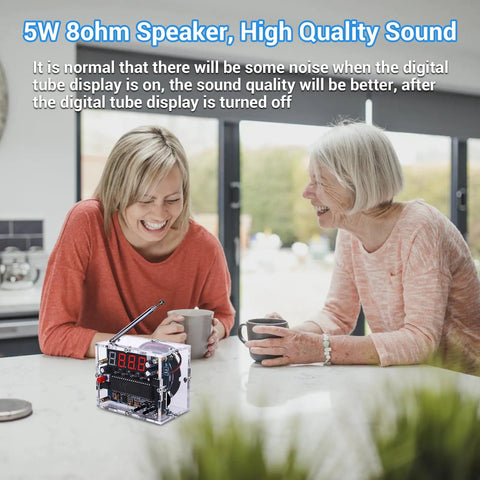 Two women laughing at kitchen table with DIY FM Radio Kit For Learning And DIY Soldering Practice 87 To 108MHz module visible.