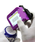 Compact Handheld Label Printer For Bottle Caps And Packaging in use, printing QR codes and production dates on a can.