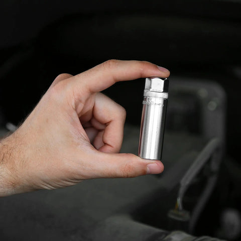 Hand holding Magnetic Five Eighths Spark Plug Socket For Three Eighths Inch Drive Engine Tune Up Tool, chrome finish.