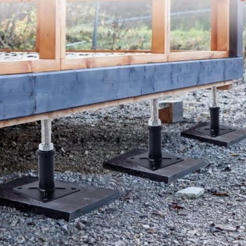 4 Pack Adjustable Floor Jack Posts No Sweat Heavy Duty Lift Supports 6 To 9 Inch Screw Jack supporting a wooden structure.