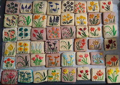 Colorful cookies with embossed floral designs using Spring Flowers Embossing Rolling Pin With 16 Floral Squares For Dough And Clay.