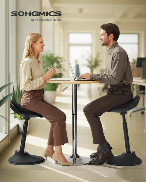 Two people using Ergonomic Wobble Stool With Height Adjustable Desk Seat For Standing Use, Swivel Balance Chair, Ink Black in an office