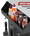 Outdoor Grill Cart With Wheels A Movable Stainless Steel Kitchen Island With Storage Cabinet And Open Shelf For BBQ Prep Black Rolling Dining Cart Table For Food Prep And Extra Counter Space, showing a spice rack with bottles and utensils.