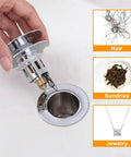 Hand holding Pop Up Sink Stopper with stainless steel filter for 1.1-1.5 inch drains next to hair, sundries, jewelry samples.