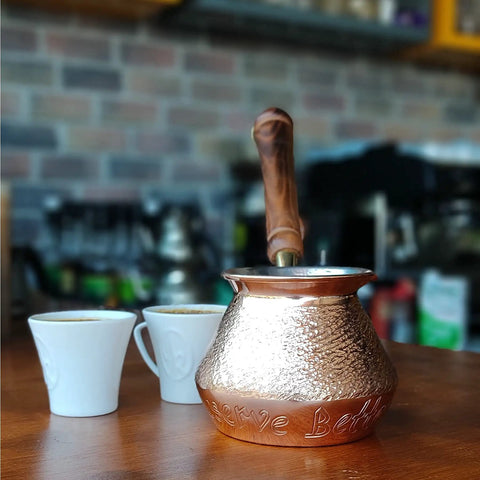 DCS Series Thickest Hammered Copper Turkish Greek Arabic Armenian Coffee Pot with Wooden Handle on table with cups