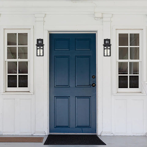 Built Different Matte Black Outdoor Wall Lights With Dusk To Dawn Motion Sensor And Water Glass Shade on blue door entrance.