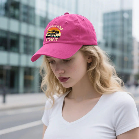 Woman wearing rose red cap with 'I Am Sexy And I Tow It Vintage Camping RV Camper Truck Hat For Men Funny Outdoor Cap With Adjustable Strap' text.