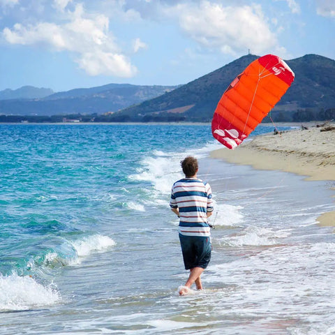 Person using Hydra II Closed Cell Foil Water Trainer Kite 3 Meter on the beach, practicing for lakes, rivers, surf days.