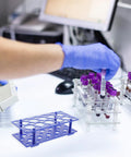 Lab technician using Two Piece Detachable Centrifuge Tube Holder Rack For 15ml And 50ml Tubes With 18 Hole And 10 Hole Configurations