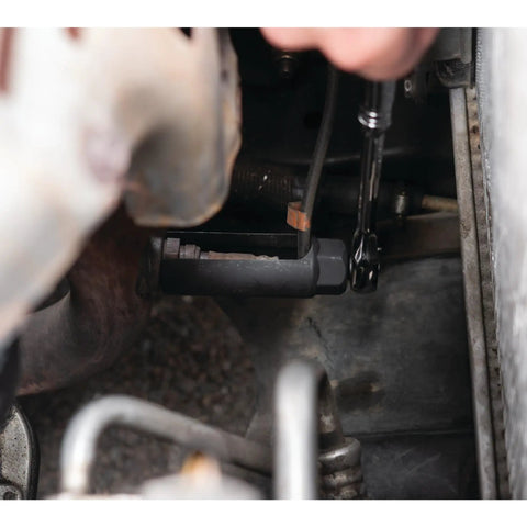 Mechanic using heavy duty oxygen sensor socket with cutaway wire clearance on engine for quick sensor removal