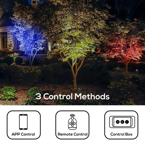 Seriously Slick Smart Outdoor RGBW Landscape Lights 5 Pack Color Changing Garden Yard Lawn Wall Tree Flags Fence LEDs IP68 Waterproof Alexa And Google Home Compatible App Voice Or Touch Control lighting up a garden with trees.