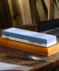 Premium Knife Sharpening Stone Whetstone 1000 6000 Grit With Non Slip Base on wooden table