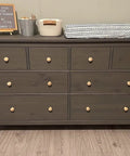 Dark wood dresser with 30 Pack Unfinished Solid Round Natural Wood Cabinet Knobs Do It Yourself Drawer Pulls For Dresser Wardrobe Cupboard And Furniture Drawers Ready To Stain Or Paint One And Three Eighths Inch Diameter installed.