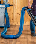Heavy Duty 4 Inch Dust Collector Hose Splice Fitting With Quick Change Handle And Built-In Swivel To Stop Hose Twisting, showing blue and black hoses connected.