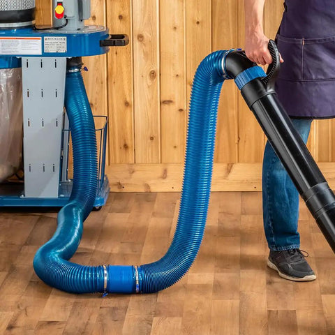 Heavy Duty 4 Inch Dust Collector Hose Splice Fitting With Quick Change Handle And Built-In Swivel To Stop Hose Twisting, showing blue and black hoses connected.