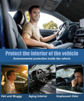 Driver sitting in Ford F150 with windshield sun shade, protecting from heat and odor, emphasizing interior protection benefits.