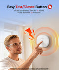 Close-up of a person using the test button on a Dual Smoke And Carbon Monoxide Detector 10 Year Sealed Battery 3 Pack Home Fire Safety Alarm.