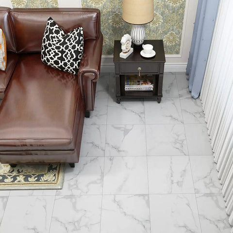 Room with brown leather chair on white marble look vinyl tiles, 12x12 inch, waterproof removable floor, renter friendly layout