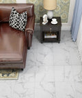 Living room with brown chair and 32 Pack Peel And Stick Vinyl Floor Tiles 12 By 12 Inches Waterproof Marble Gray White Laminate Floor Sticker Tiles