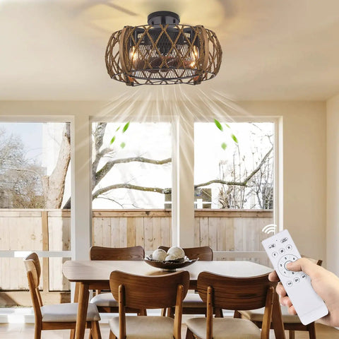 Industrial Farmhouse 17 Inch Black Caged Ceiling Fan With Remote Light Kit installed above dining table, remote in hand.