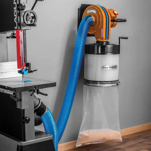 Heavy Duty Wall Mount Dust Collector Generating 650 Cfm Airflow With Precision One Micron Canister Filter mounted beside a bandsaw.
