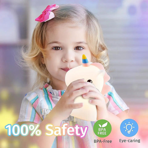 Child holding Unicorn Night Light For Kids With Sound Machine, 16 Color Silicone Baby Night Lamp USB Rechargeable Portable Bedroom Decor