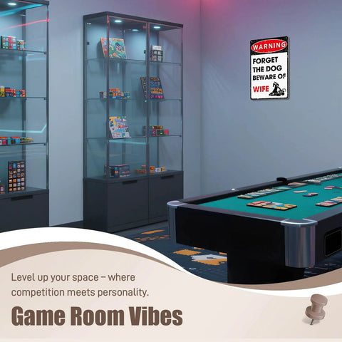 Hella Durable Metal Wall Art Sign For The Man Cave Featuring Funny Forget The Dog Beware Of Wife Quote in aluminum above game room table.