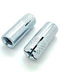 Two Twenty Premium Zinc Plated Carbon Steel Drop-In Anchors For Concrete Use With 1/4-20 Bolts showing knurled locking design