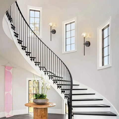 Lit Black Crystal Vanity Lights Set Of 2 Industrial Mid Century Wall Sconces illuminating a modern staircase with round window accents.