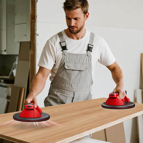 Man using Cordless Vacuum Lifter For Glass And Tile with 21 Cm NBR Base on wooden surface