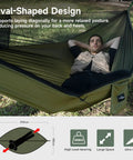 Camping Hammock With Mosquito Net And Ridge Rope For Two, Extra Large 114x55 Inch, shown with person lounging outdoors