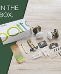 Porcelain White Door Knobs With Privacy Lock For Interior Doors box contents and hardware displayed on wooden surface.