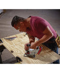 Shop Tested 20V Max Cordless Jigsaw With Built In Dust Blower And Easy Swap Blade Clamp in use on plywood by a carpenter.