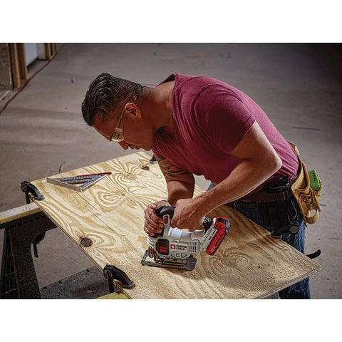 Shop Tested 20V Max Cordless Jigsaw With Built In Dust Blower And Easy Swap Blade Clamp in use on plywood by a carpenter.