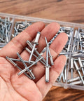Hand holding aluminum rivets from 500 Piece Aluminum Blind Rivet Kit With 14 Size Assortment Pop Rivets Set For DIY Auto Marine