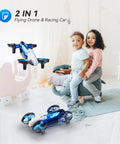 Children indoors play with 2 In 1 Mini Drone For Kids And Teens With 7 Plus 2 Light Modes And 5 Flying Postures and land mode toy.