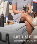 Person sitting on boat using 100 Qt Wheeled Marine Cooler With Fully Insulated Lid And Body Keeps Ice Up To Five Days In 90 Degree Heat Holds 160 Cans UV Coated Exterior And Rust Resistant Stainless Hardware Built Tough For Weekend Adventures as a seat