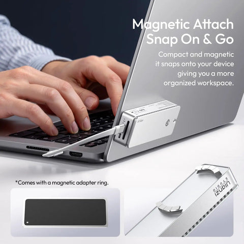 Hands connecting a Heavy Hitting M2 NVMe Enclosure Delivering Legit 80Gbps USB4 Speeds to a laptop for portable storage.