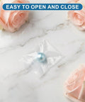 Mini Clear Plastic Bags For Jewelry And Beads On The Go, 200 Pcs Resealable 1.57 By 2.36 Inch Baggies shown with a pearl on marble