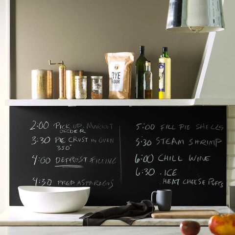 Chalkboard with menu items written in white chalk using Chalkboard Paint For Walls In Black 1 Quart, 100 Percent Acrylic Interior Paint.