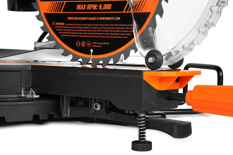 Close-up of the 15 Amp 10 Inch Dual Bevel Sliding Compound Miter Saw With LED Cutline showing blade and orange rail system