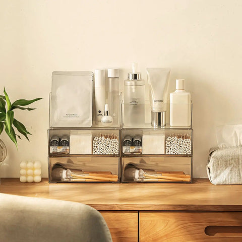 Two Tier Drawer Organizer For Medicine Cabinet Stackable Clear Storage Drawers For Small Bathroom Vanity Cabinet Mirror Or Wall Mount Keeps Essentials Neat And Visible on a wooden shelf with makeup and skincare items above.