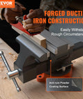 6.5 Inch Jaw Vise With 360 Degree Swivel Locking Base on workbench, ductile iron construction, showing replaceable carbon steel jaw plates.