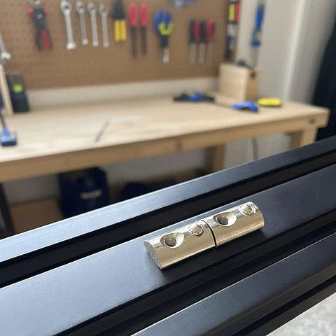 M6 X 1.0 T Slot Nut With Spring Ball Loaded, 10 Pack, Carbon Steel, installed on 8mm aluminum extrusion rail in workshop setting